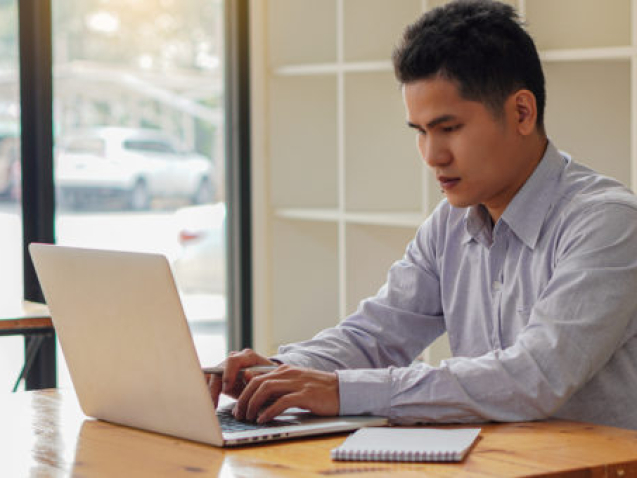 A,Young,Businessman,Working,At,Home,With,A,Laptop,On